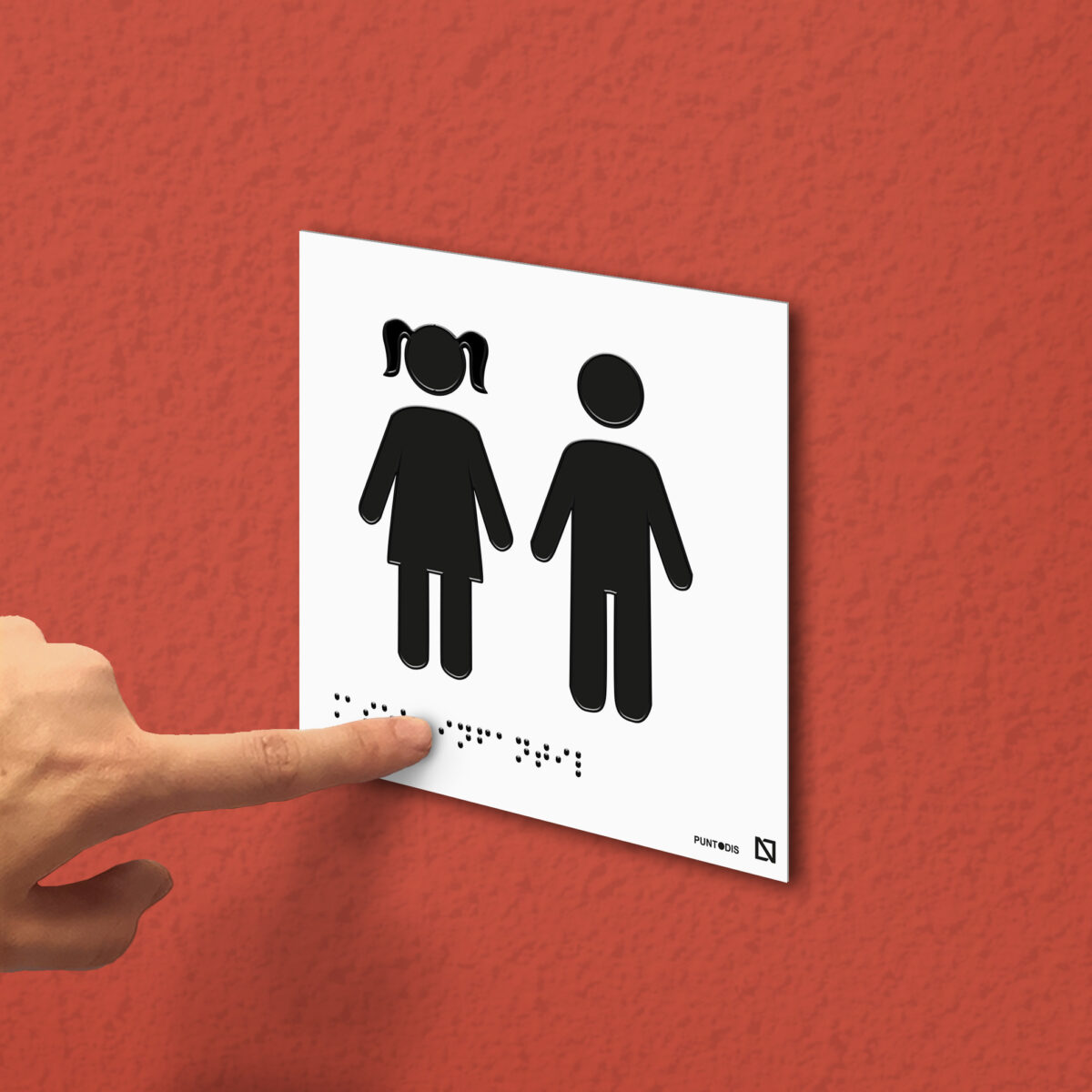 Ejemplo de colocación de la placa de aseo infantil mixto en una pared
