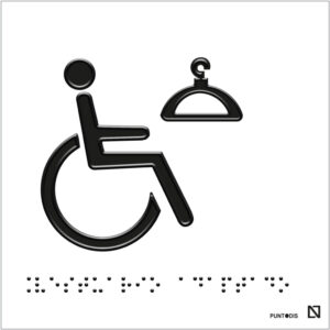 Placa con pictograma de vestuario junto con el símbolo de SIA en braille y fondo blanco